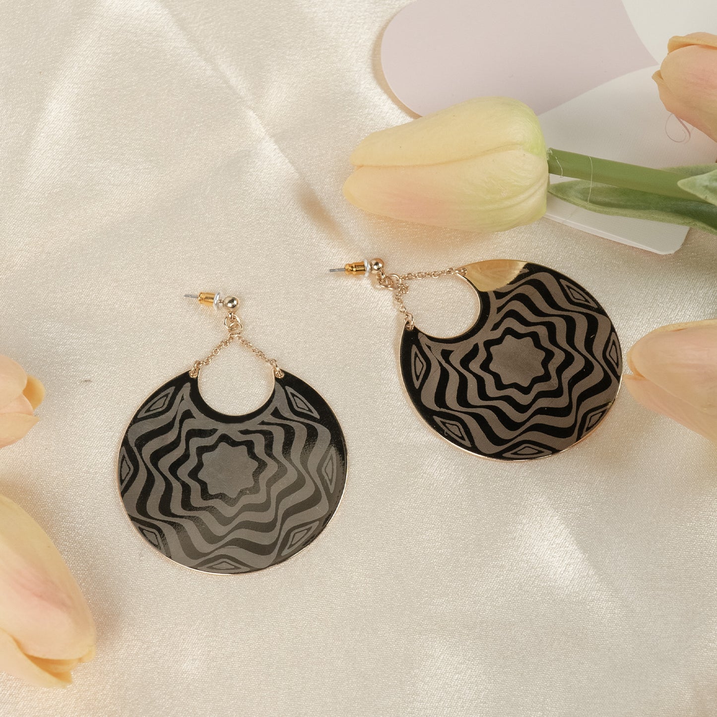 Bewildered patterned metal drop earrings
