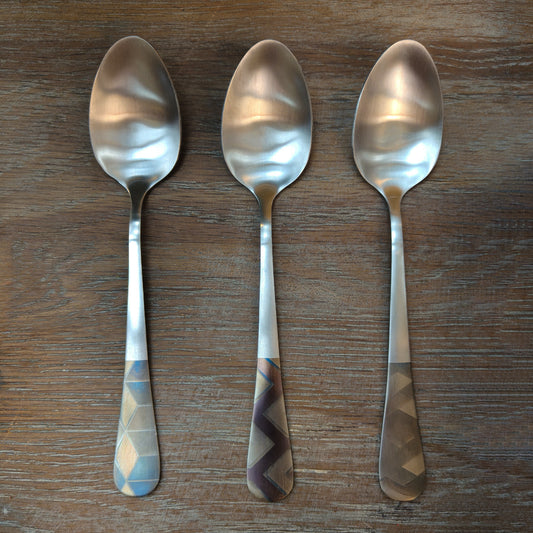 Iron spoon handle with colorful geometric pattern engraving