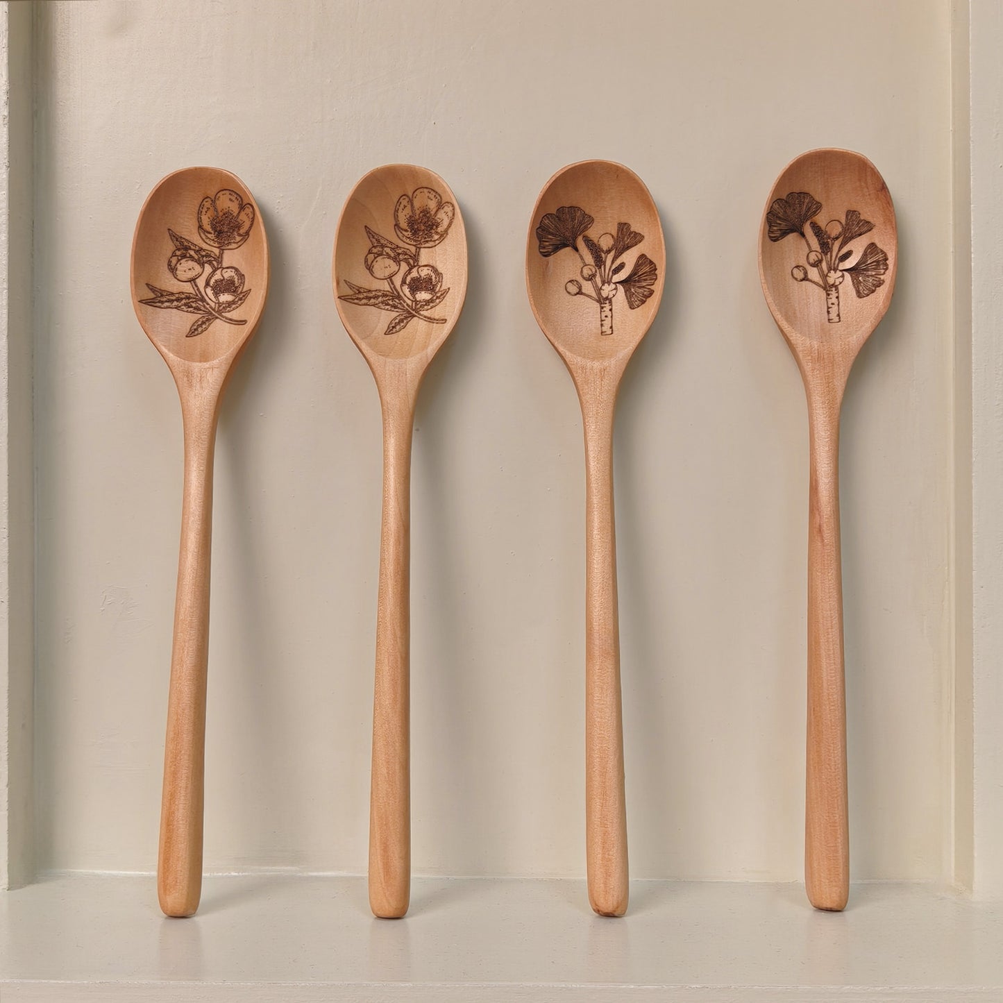 Wooden spoon with plant pattern engraving