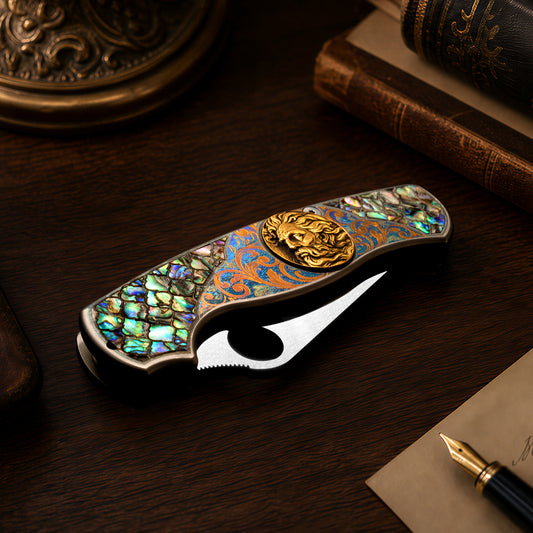 Titanium folding pocket knife with brass deep engraving, color engraving and mother-of-pearl inlay