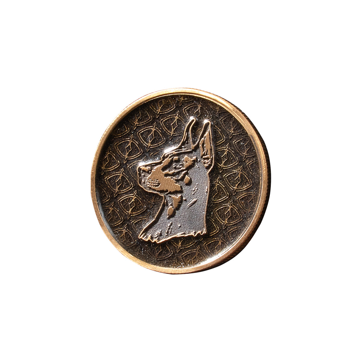 Deep-relief brass coin featuring a Doberman Pinscher